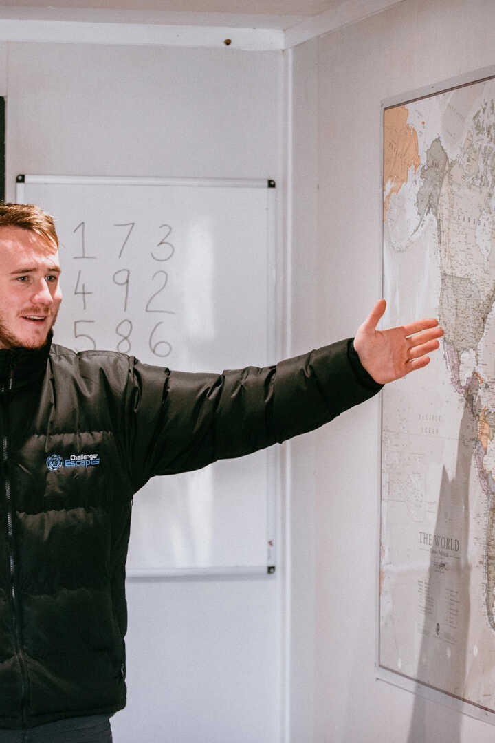 team explaining a puzzle at a conference event