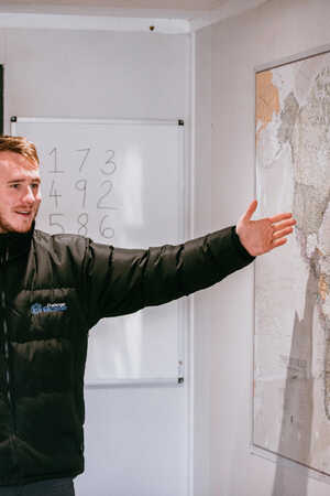 team explaining a puzzle at a conference event