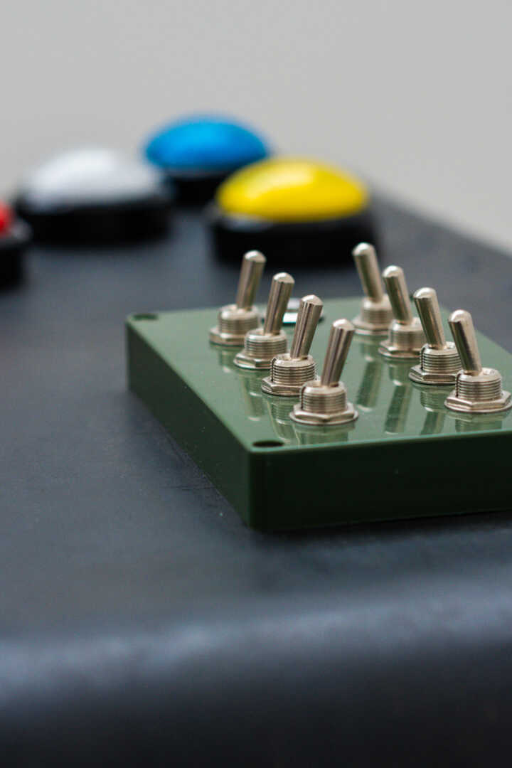 Puzzle image including switches and coloured buttons